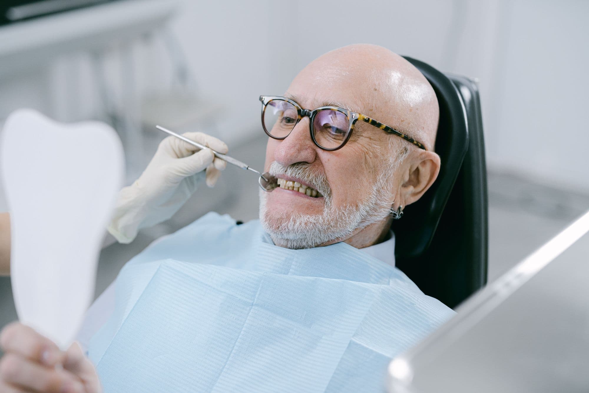 A dentist and an older patient